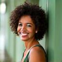 Portrait of Sarah M., 42, smiling confidently.